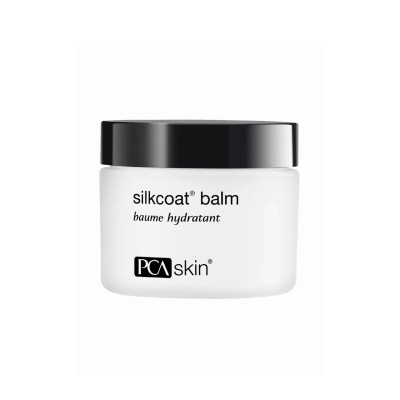 A close-up of silkcoat balm, showcasing its smooth texture and packaging, designed for soothing PSA skin conditions.