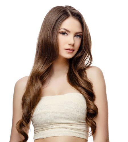A beautiful young woman with long, wavy hair, exuding elegance and charm in a serene setting.