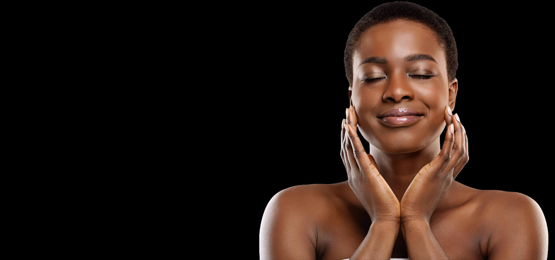 A woman with smooth, glowing skin gently touching her face, representing long-lasting skin care results